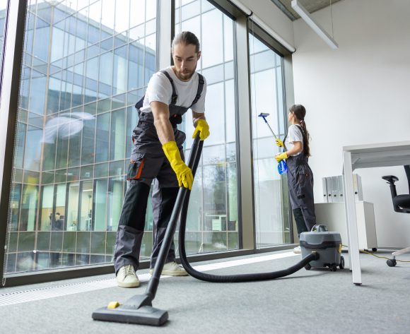 Janitors cleaning modern office space